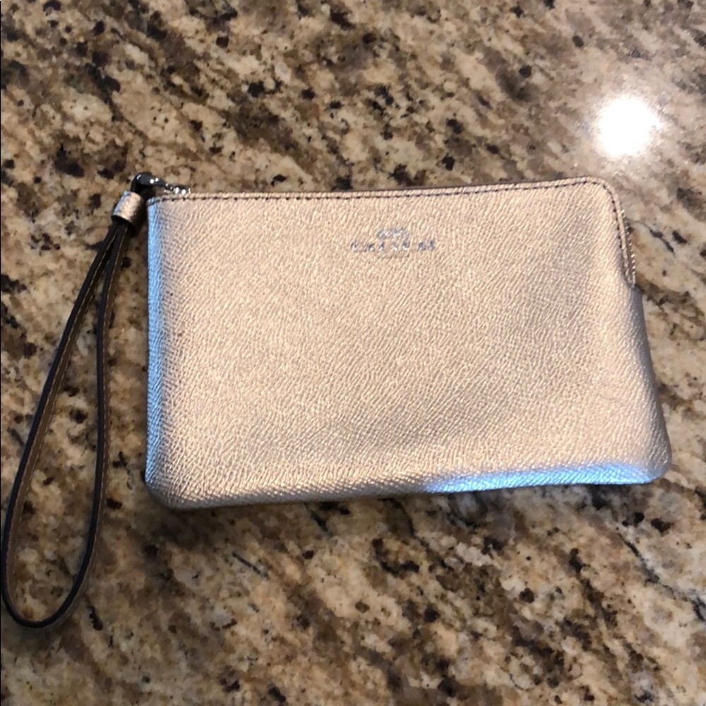 Small gold Coach wristlet.
